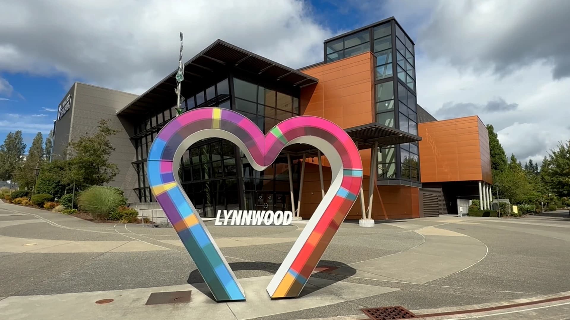 The Lynnwood Event Center entrance, with a large colorful heart sculpture spelling out Lynnwood in front